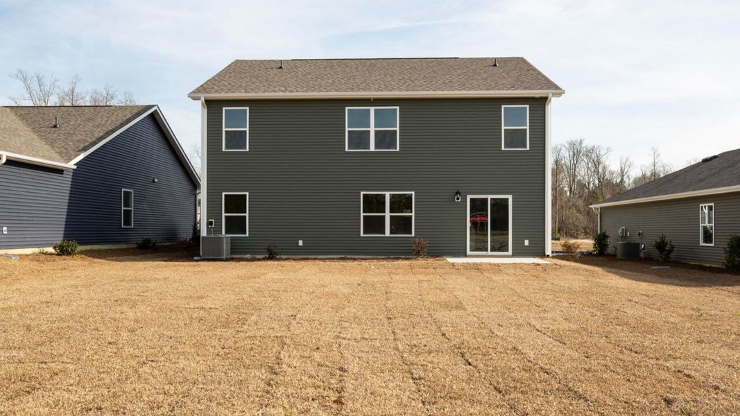 Exterior details and patio area of a home in Cedar Hill Landing, Navassa (Image 2). Exterior details and patio area of a home in Cedar Hill Landing, Navassa (Image 2).