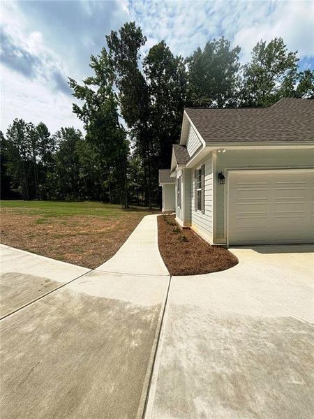 Front exterior of a new home in , Milledgeville, GA, highlighting curb appeal (Image 18).
