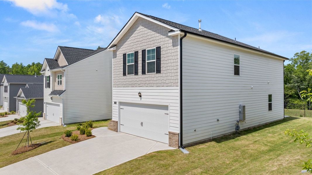 Front exterior of a new home in The Abbey at Trolley Run Station, Aiken, SC, highlighting curb appeal (Image 21).