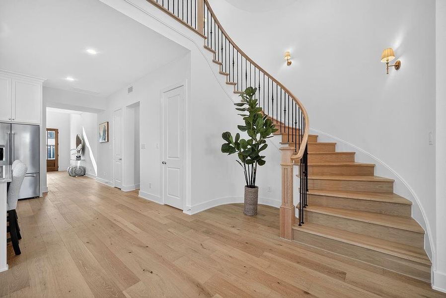 Stairway featuring wood finished floors Stairway featuring wood finished floors
