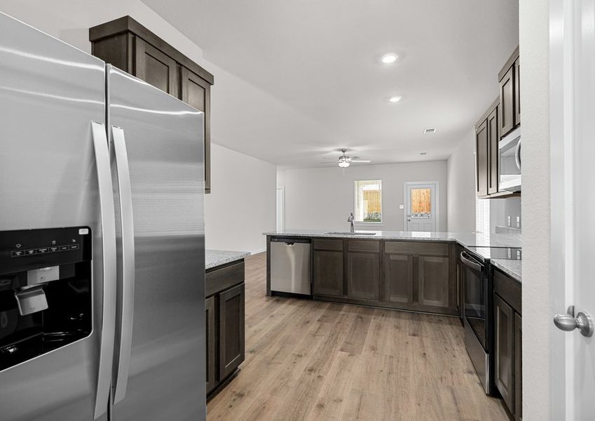 The kitchen has stainless-steel, energy-efficient appliances.