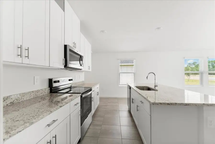 Furnished interior view inside a new home in Flagler Village - Classic Series, Palm Coast (Image 7). Furnished interior view inside a new home in Flagler Village - Classic Series, Palm Coast (Image 7).