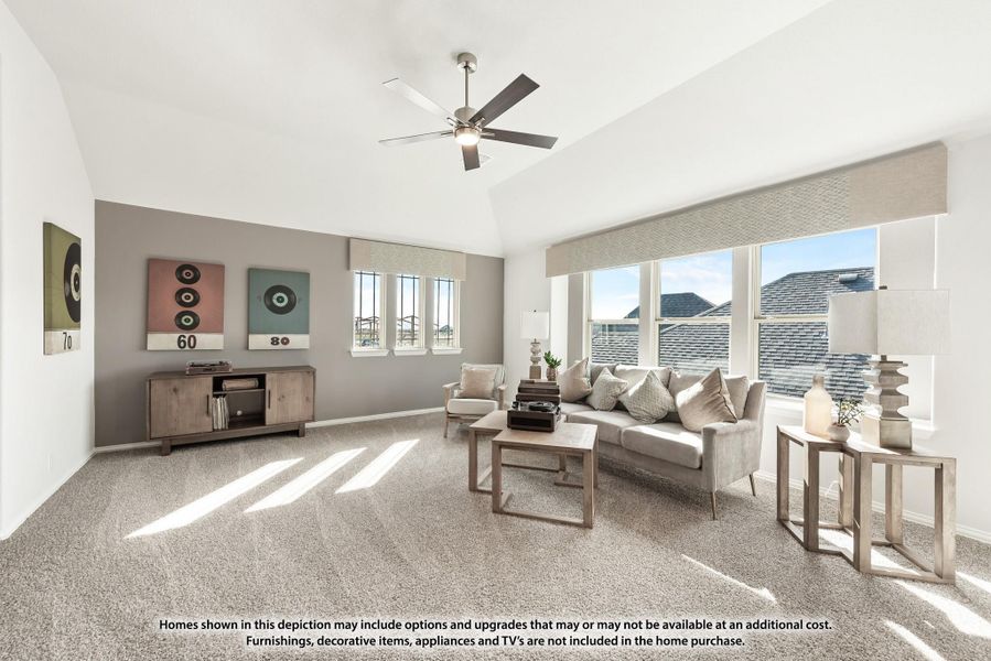 Living room with vaulted ceiling, ceiling fan, carpet flooring, and large windows with natural light Living room with vaulted ceiling, ceiling fan, carpet flooring, and large windows with natural light