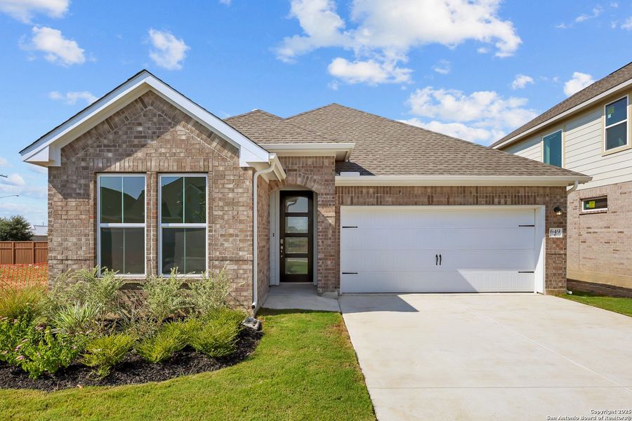 Front exterior of a new home in Sunflower Ridge, New Braunfels, TX, highlighting curb appeal (Image 17). Front exterior of a new home in Sunflower Ridge, New Braunfels, TX, highlighting curb appeal (Image 17).