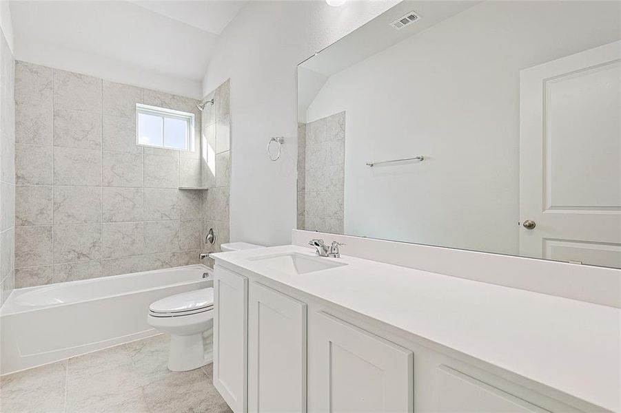 Full bath with vanity and shower / tub combination