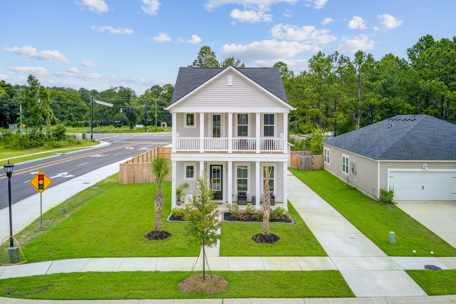 Front exterior of a new home in Limehouse Village: Row Collection, Summerville, SC, highlighting curb appeal (Image 20).