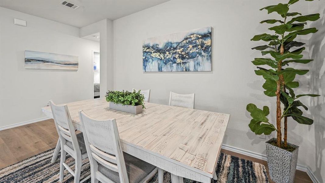Dining area with wood finished floors