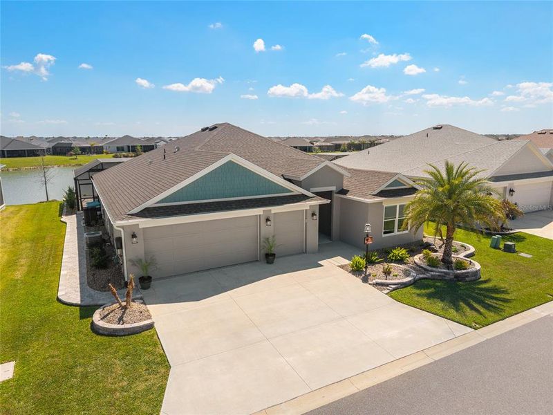Front exterior of a new home in , The Villages, FL, highlighting curb appeal (Image 21).