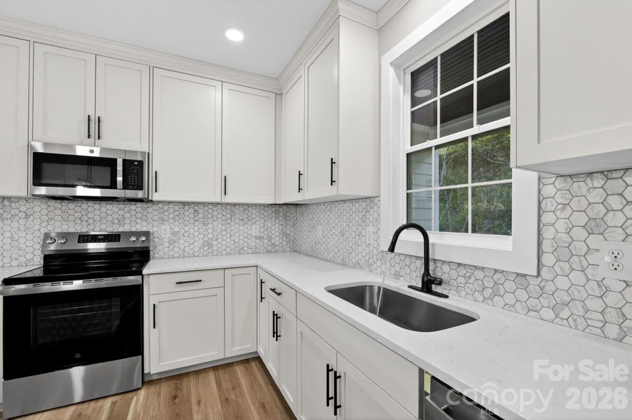 Furnished interior view inside a new home in , Lenoir (Image 11).