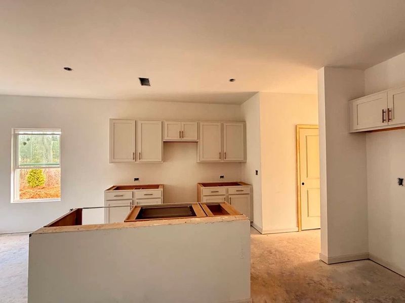 Kitchen featuring Serene Collection Finishes Construction Progress Kitchen featuring Serene Collection Finishes Construction Progress