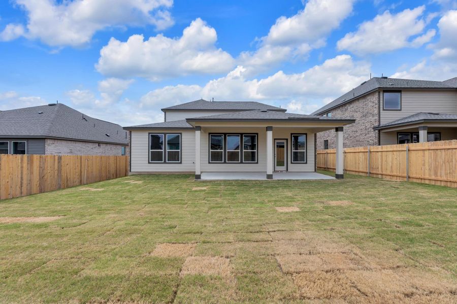 Front exterior of a new home in Salerno - Classic Collection, Round Rock, TX, highlighting curb appeal (Image 18).