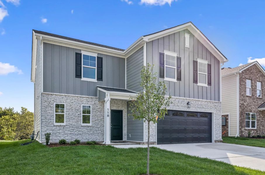 Front exterior of a new home in Ascent at Arbor Ridge, La Vergne, TN, highlighting curb appeal (Image 1). Front exterior of a new home in Ascent at Arbor Ridge, La Vergne, TN, highlighting curb appeal (Image 1).