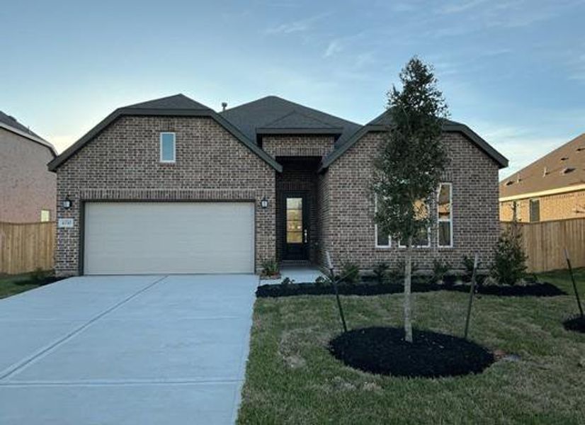 Front exterior of a new home in Legacy, League City, TX, highlighting curb appeal (Image 2). Front exterior of a new home in Legacy, League City, TX, highlighting curb appeal (Image 2).