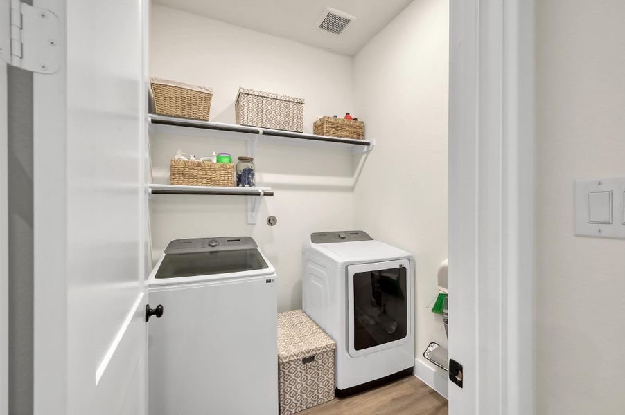 Dedicated utility space with built-in storage for added convenience.