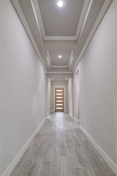 Hallway featuring ornamental molding and light wood-type flooring