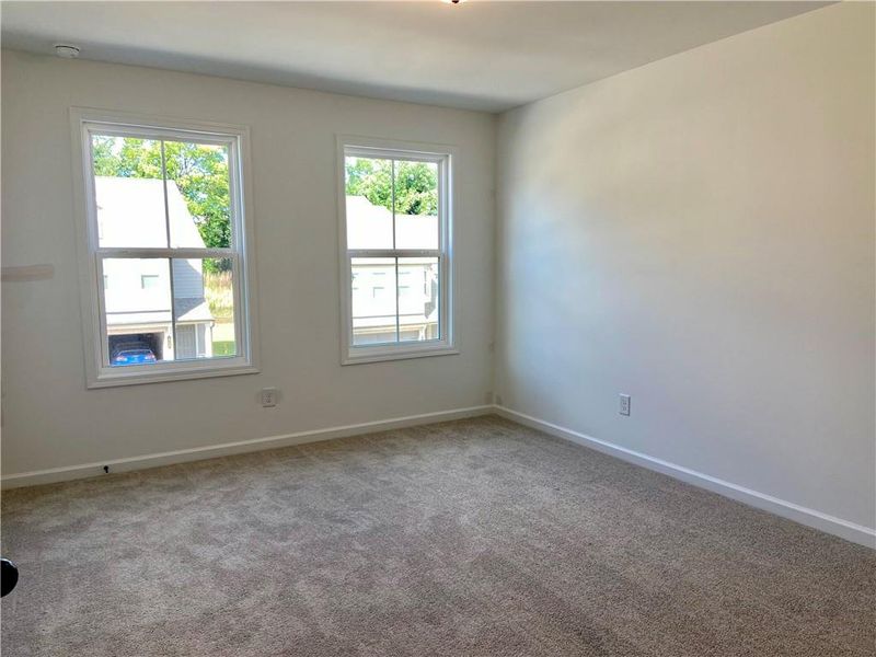 Spacious, unfurnished interior of a new home in Eastlyn Crossing, Flowery Branch (Image 17).