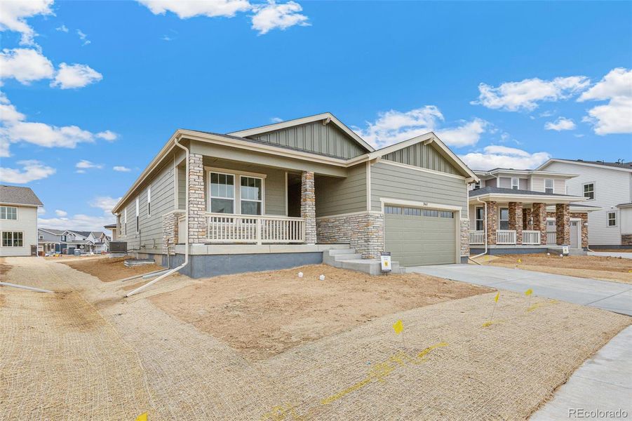 Front exterior of a new home in Painted Prairie, Aurora, CO, highlighting curb appeal (Image 22).
