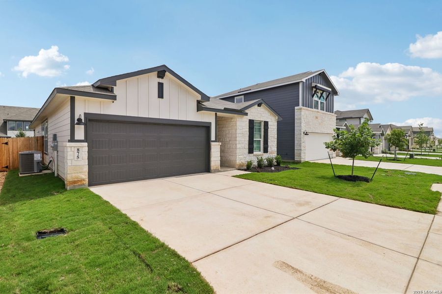 Front exterior of a new home in Estancia Ranch - Premier Series, San Antonio, TX, highlighting curb appeal (Image 25).