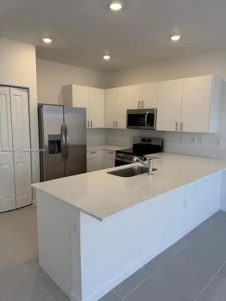 Furnished interior view inside a new home in , Homestead (Image 4). Furnished interior view inside a new home in , Homestead (Image 4).
