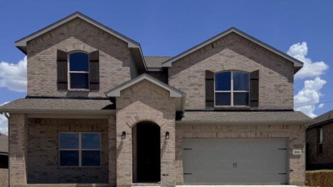 Front exterior of a new home in Bluestem, Rhome, TX, highlighting curb appeal (Image 1). Front exterior of a new home in Bluestem, Rhome, TX, highlighting curb appeal (Image 1).