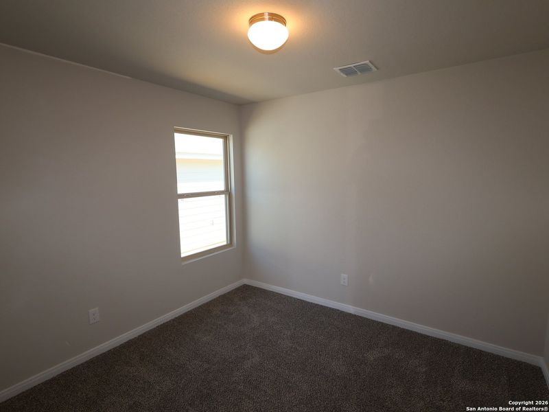 Spacious, unfurnished interior of a new home in Hunters Ranch, San Antonio (Image 17).