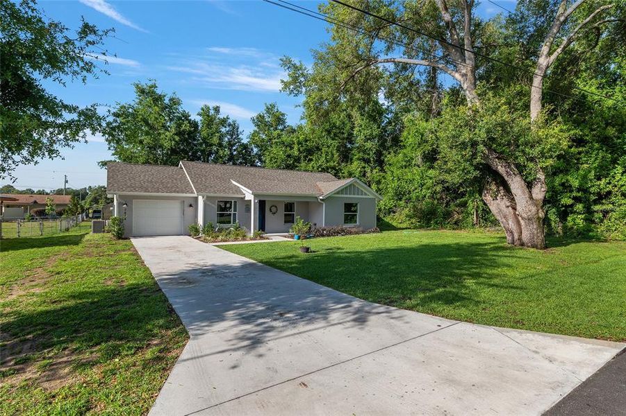 Front exterior of a new home in , Belleview, FL, highlighting curb appeal (Image 24).