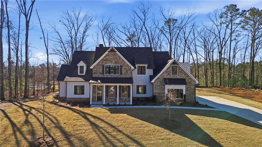 Front exterior of a new home in , Canton, GA, highlighting curb appeal (Image 26).