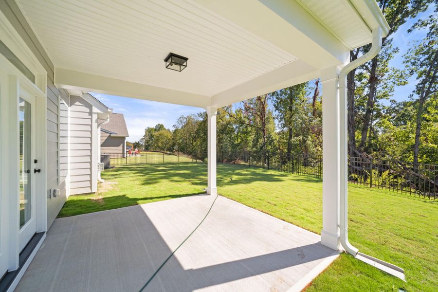 Exterior details and patio area of a home in Fiddler's Ridge, Advance (Image 2).