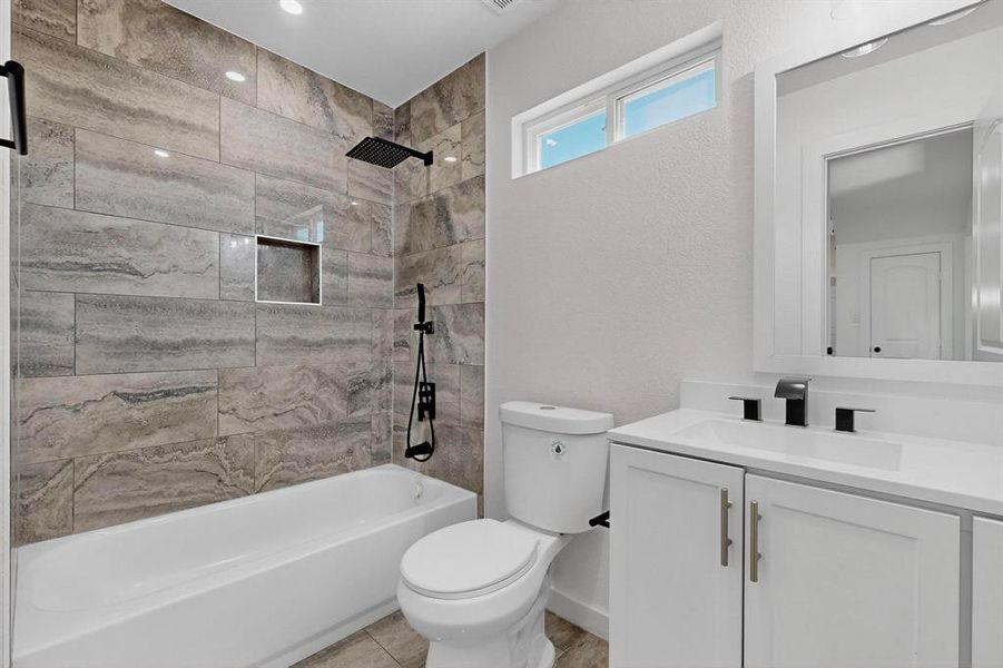 Full bath with vanity and shower / tub combination