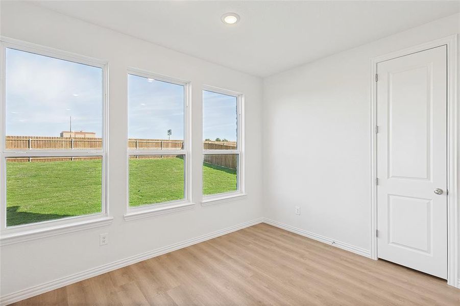 Spare room with light wood-type flooring