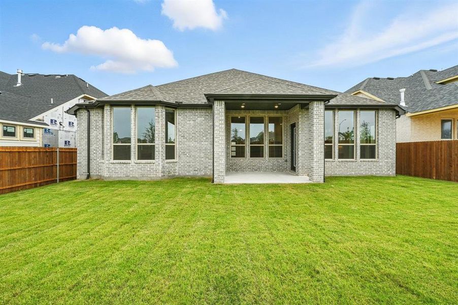 Front exterior of a new home in Wildflower Ranch: Artisan Series - 60ft. lots, Dish, TX, highlighting curb appeal (Image 2).