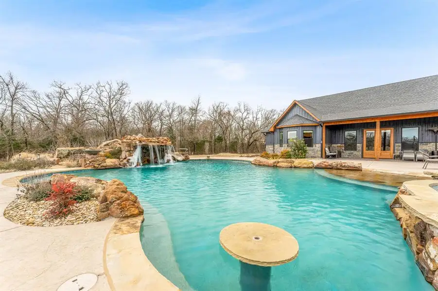 Swimming pool with a patio