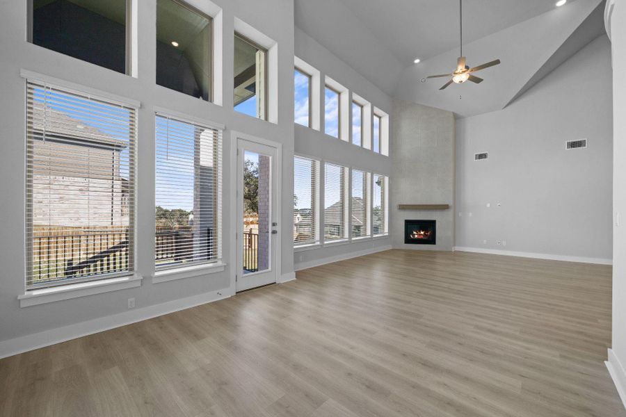 Family Room with soaring ceiling & fireplace