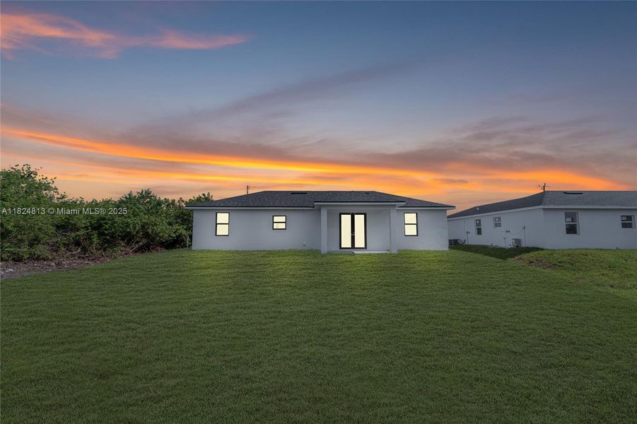 Front exterior of a new home in , Lehigh Acres, FL, highlighting curb appeal (Image 20). Front exterior of a new home in , Lehigh Acres, FL, highlighting curb appeal (Image 20).