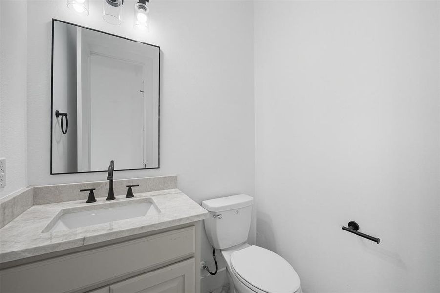 Bathroom with vanity and toilet