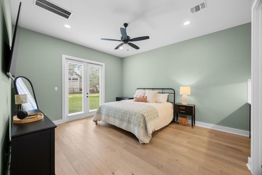 Bedroom with access to exterior, light wood finished floors, recessed lighting, and a ceiling fan