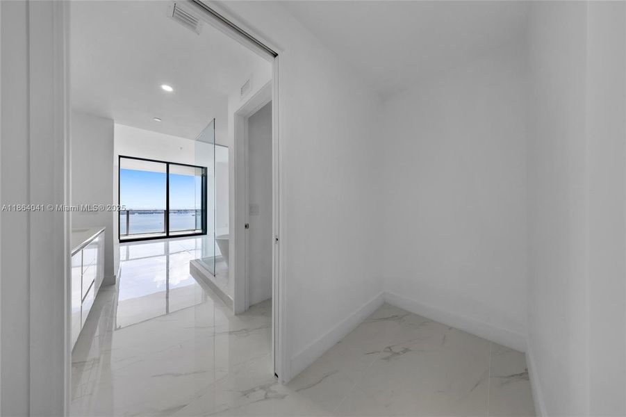 Spacious, unfurnished interior of a new home in Aria Reserve, Miami (Image 21). Spacious, unfurnished interior of a new home in Aria Reserve, Miami (Image 21).