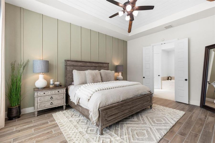Primary Suite with Board and Battan accent wall and accent paint