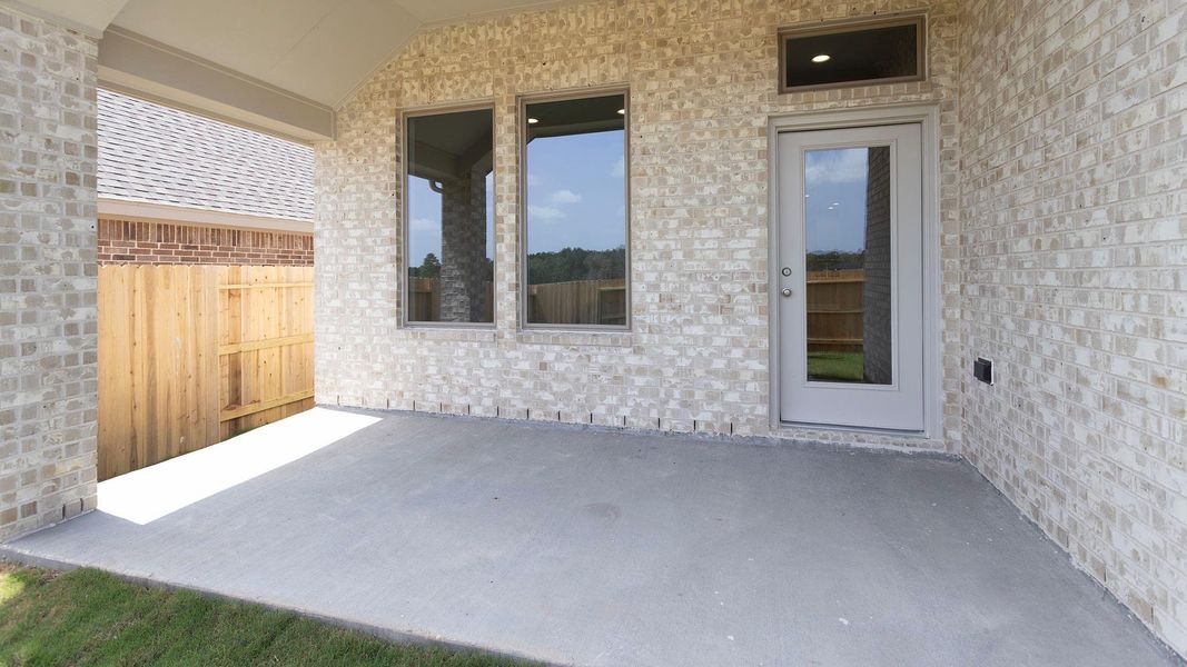 Exterior details and patio area of a home in Wildtree, Magnolia (Image 3).