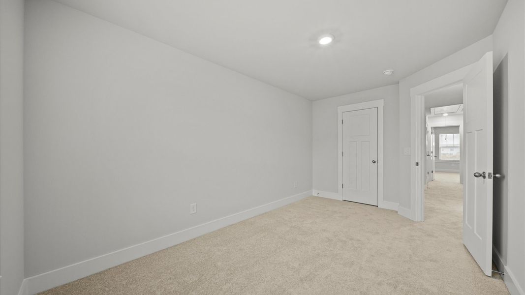 Vibrant and restful bedroom with oversized windows, refined detail, and a warm, welcoming atmosphere