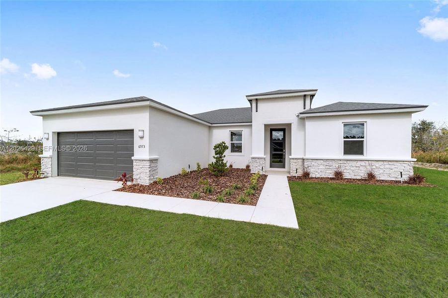 Front exterior of a new home in , Palm Bay, FL, highlighting curb appeal (Image 22).