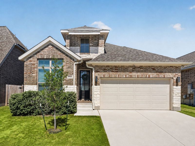 Front exterior of a new home in Kallison Ranch, San Antonio, TX, highlighting curb appeal (Image 2). Front exterior of a new home in Kallison Ranch, San Antonio, TX, highlighting curb appeal (Image 2).