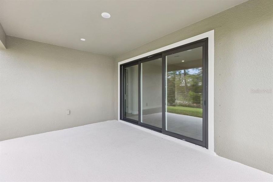 Exterior details and patio area of a home in Caldera, Spring Hill (Image 16).
