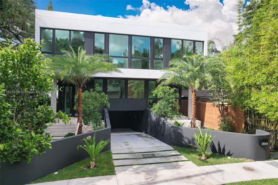 Front exterior of a new home in , Miami, FL, highlighting curb appeal (Image 1). Front exterior of a new home in , Miami, FL, highlighting curb appeal (Image 1).