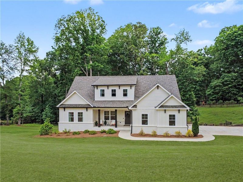 Front exterior of a new home in , Hoschton, GA, highlighting curb appeal (Image 21).