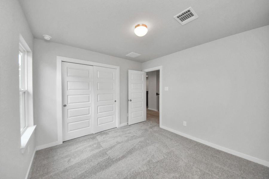 Generously sized secondary bedrooms featuring spacious closets, soft and inviting carpeting underfoot, large windows allowing plenty of natural light, and the added touch of privacy blinds for your personal retreat. Generously sized secondary bedrooms featuring spacious closets, soft and inviting carpeting underfoot, large windows allowing plenty of natural light, and the added touch of privacy blinds for your personal retreat.