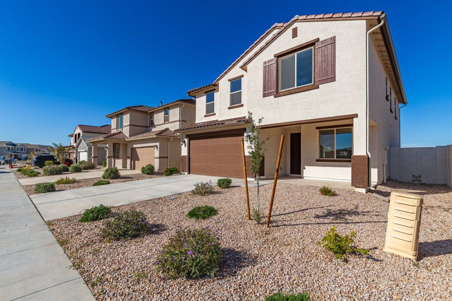 Front exterior of a new home in Wildera, San Tan Valley, AZ, highlighting curb appeal (Image 2). Front exterior of a new home in Wildera, San Tan Valley, AZ, highlighting curb appeal (Image 2).