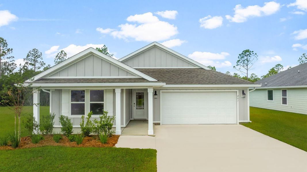 Front exterior of a new home in Palmetto Bluff, Port Saint Joe, FL, highlighting curb appeal (Image 1).