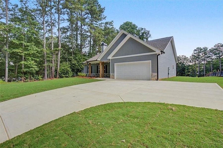 Front exterior of a new home in , Dallas, GA, highlighting curb appeal (Image 21). Front exterior of a new home in , Dallas, GA, highlighting curb appeal (Image 21).