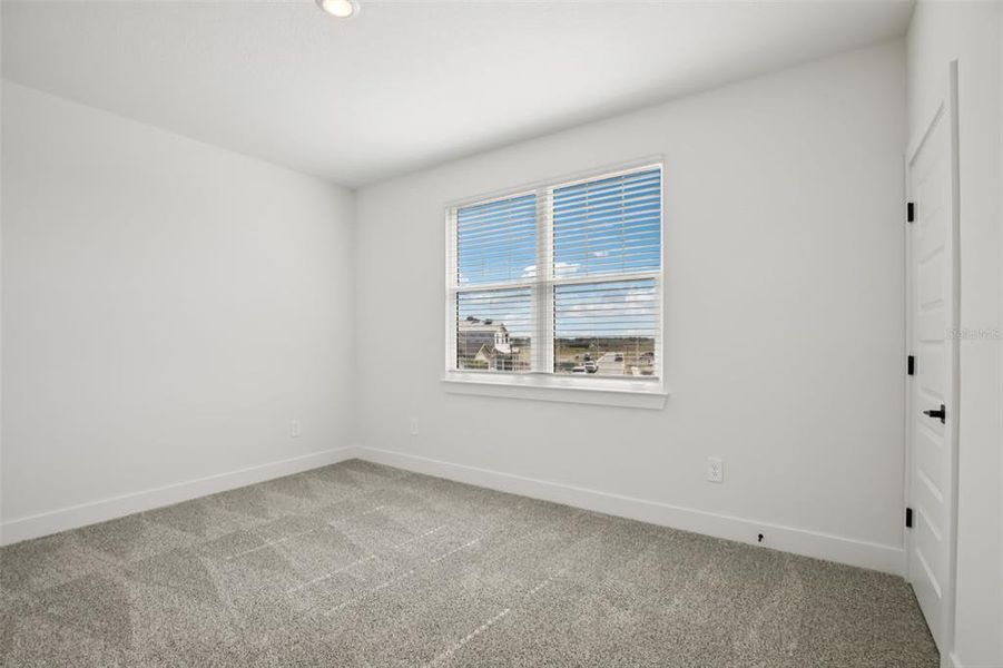 Spacious, unfurnished interior of a new home in Magnolia Bay - Reserve Series, Nokomis (Image 31).